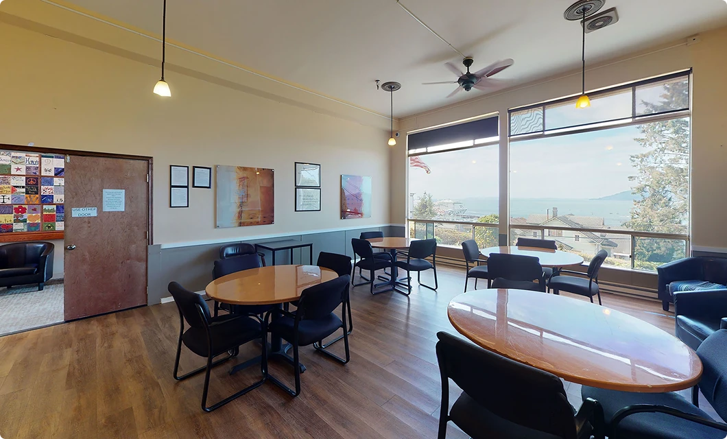 A common room at Virtue at The Pointe with a view of the Columbia River