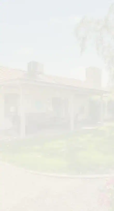 Suburban single-story house with a covered porch and front yard